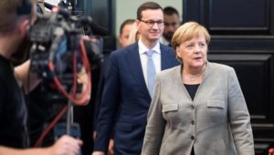 Besuch in Warschau: Affront gegen Merkel – Polen rückt vom Migrationspakt ab